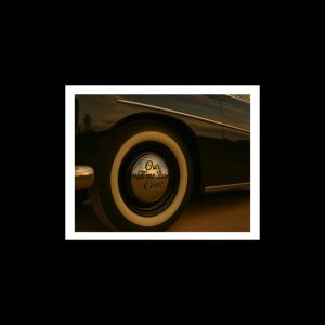 Black classic car  and hubcap, landscape